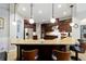Gourmet kitchen featuring granite countertops, stainless steel appliances, and pendant lighting over the breakfast bar at 4103 Se 10Th Ave, Ocala, FL 34480