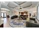 Bright and open living room with plenty of seating, tray ceiling, and access to the kitchen at 4103 Se 10Th Ave, Ocala, FL 34480