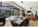 Screened-in lanai with outdoor dining and lounge areas beside the sparkling pool at 4103 Se 10Th Ave, Ocala, FL 34480