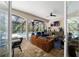 Covered outdoor living area with dining and seating, overlooking the screened pool at 4103 Se 10Th Ave, Ocala, FL 34480