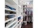 Walk-in closet featuring custom shelving and hanging racks for ample storage at 4103 Se 10Th Ave, Ocala, FL 34480