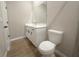 Bathroom features a modern vanity with dual sinks and a toilet at 4524 Sw 110Th St, Ocala, FL 34476