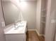 Bathroom featuring a double sink vanity with a large mirror and shelving on the side at 4524 Sw 110Th St, Ocala, FL 34476
