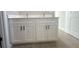 Bathroom vanity features dual sinks, white cabinets, and black hardware at 4524 Sw 110Th St, Ocala, FL 34476