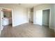 Spacious bedroom featuring tile floors, neutral paint, a walk in closet and a glimpse of an ensuite bath at 4524 Sw 110Th St, Ocala, FL 34476