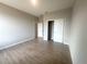 Spacious bedroom featuring tile floors, neutral paint, and a closet with sliding doors at 4524 Sw 110Th St, Ocala, FL 34476