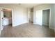 A bedroom with tile flooring and a sliding door closet and attached bathroom at 4524 Sw 110Th St, Ocala, FL 34476