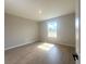 A bedroom with tile flooring and a bright window bringing in natural light at 4524 Sw 110Th St, Ocala, FL 34476