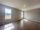 Bedroom featuring tile floors and natural light from two windows at 4524 Sw 110Th St, Ocala, FL 34476