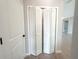 Image of a closet with bi-fold doors, featuring wood-style tile flooring and white trim at 4524 Sw 110Th St, Ocala, FL 34476