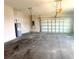 Spacious garage with concrete floor, garage door, and an installed water heater at 4524 Sw 110Th St, Ocala, FL 34476