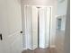 View of hall closet featuring double doors and metal shelving at 4524 Sw 110Th St, Ocala, FL 34476