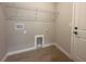 A well-organized laundry room with a wire rack for storage and hookups ready for a washer and dryer at 4524 Sw 110Th St, Ocala, FL 34476