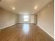 Bright and airy living room featuring recessed lighting and wood-look flooring at 4524 Sw 110Th St, Ocala, FL 34476