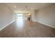 Open-concept living room with recessed lighting and wood-style flooring throughout the home at 4524 Sw 110Th St, Ocala, FL 34476