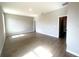 Bright living room with wood-style tile flooring, neutral walls and white trim at 4524 Sw 110Th St, Ocala, FL 34476