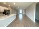 Open concept floor plan showing neutral flooring, an island kitchen, and modern lighting at 4524 Sw 110Th St, Ocala, FL 34476