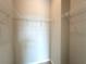 Neutral walk-in closet with white metal shelving at 4524 Sw 110Th St, Ocala, FL 34476