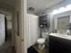 Standard bathroom with a shower, toilet, vanity, and a mirrored medicine cabinet at 4580 Sw 110Th Ln, Ocala, FL 34476