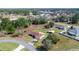 An aerial view of the home showcasing the expansive backyard and complemented by beautiful surrounding greenery and a cul-de-sac at 4858 Sw 143Rd Loop, Ocala, FL 34473