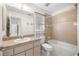 Bathroom featuring a shower-tub combo, a light color vanity, and neutral tile work at 4858 Sw 143Rd Loop, Ocala, FL 34473