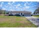 Charming single-story home with a well-maintained lawn and an attached two-car garage at 4858 Sw 143Rd Loop, Ocala, FL 34473