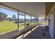 Relaxing screened porch perfect for enjoying the outdoors bug free with view of large backyard at 4858 Sw 143Rd Loop, Ocala, FL 34473