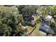 Aerial view of fenced backyard with a pool, palm trees, and shed at 5205 Ne 3Rd St, Ocala, FL 34470