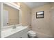 Bathroom featuring a vanity, toilet, and tub with shower at 5205 Ne 3Rd St, Ocala, FL 34470