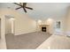 Comfortable living room with neutral tones, a fireplace, and sliding glass door to the outside at 5205 Ne 3Rd St, Ocala, FL 34470