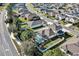 Aerial view showcasing the home with a pool in a well-maintained neighborhood with tree-lined streets at 5417 Sw 49Th Ave, Ocala, FL 34474