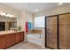 Bathroom featuring a soaking tub, a walk-in shower, and double vanity sinks at 5417 Sw 49Th Ave, Ocala, FL 34474