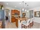 Bright kitchen featuring granite counters, an island with seating, and stainless steel appliances at 5417 Sw 49Th Ave, Ocala, FL 34474