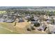 Aerial view of a residential community with mature landscaping and lake views at 6780 Sw 91St Cir, Ocala, FL 34481