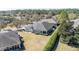 Aerial view of the home displaying the screened lanai, lawn, and landscaping at 6780 Sw 91St Cir, Ocala, FL 34481