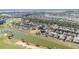 Overhead shot of a golf course community featuring waterfront property and well-maintained lawns at 6780 Sw 91St Cir, Ocala, FL 34481