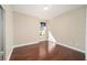 Bedroom with hardwood floors, neutral walls, and natural light, creating a warm and inviting atmosphere at 6780 Sw 91St Cir, Ocala, FL 34481