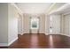 Bright dining room with hardwood floors, stylish chandelier, and ample natural light at 6780 Sw 91St Cir, Ocala, FL 34481