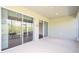 Enclosed lanai with sliding glass doors allows natural light to illuminate the space at 6780 Sw 91St Cir, Ocala, FL 34481