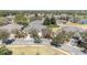 Street view of a suburban home with a well-maintained lawn and mature trees at 6780 Sw 91St Cir, Ocala, FL 34481