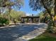 Elegant entrance with a modern design and lush landscaping at 7649 Sw 180Th Cir, Dunnellon, FL 34432