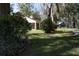 View of the home's back patio and landscaped yard at 7972 Midway Drive Ter # O103, Ocala, FL 34472