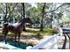 View of the property featuring horse statue, gazebo, and charming white picket fences at 7972 Midway Drive Ter # O103, Ocala, FL 34472