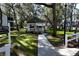 Gazebo in a manicured community space with a white picket fence and walking path at 7972 Midway Drive Ter # O103, Ocala, FL 34472