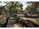 Neighborhood street view with mature trees and sidewalks at 7972 Midway Drive Ter # O103, Ocala, FL 34472