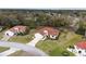 Overview of a single-Gathering home with tile roof, manicured lawn, and landscaped surroundings in a neighborhood at 8223 Sw 113Th Ln, Ocala, FL 34481