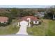 Aerial view of a single Gathering home with manicured landscaping and a tile roof in a quiet neighborhood at 8223 Sw 113Th Ln, Ocala, FL 34481