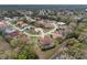 Aerial view of a well maintained neighborhood with mature trees and lush landscaping at 8223 Sw 113Th Ln, Ocala, FL 34481