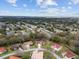 High angle shows a quiet neighborhood with mature trees and well-spaced homes, offering a peaceful atmosphere at 8223 Sw 113Th Ln, Ocala, FL 34481