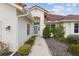 Charming one-story home with a terracotta-colored roof, two-car garage, and well-manicured landscaping at 8223 Sw 113Th Ln, Ocala, FL 34481